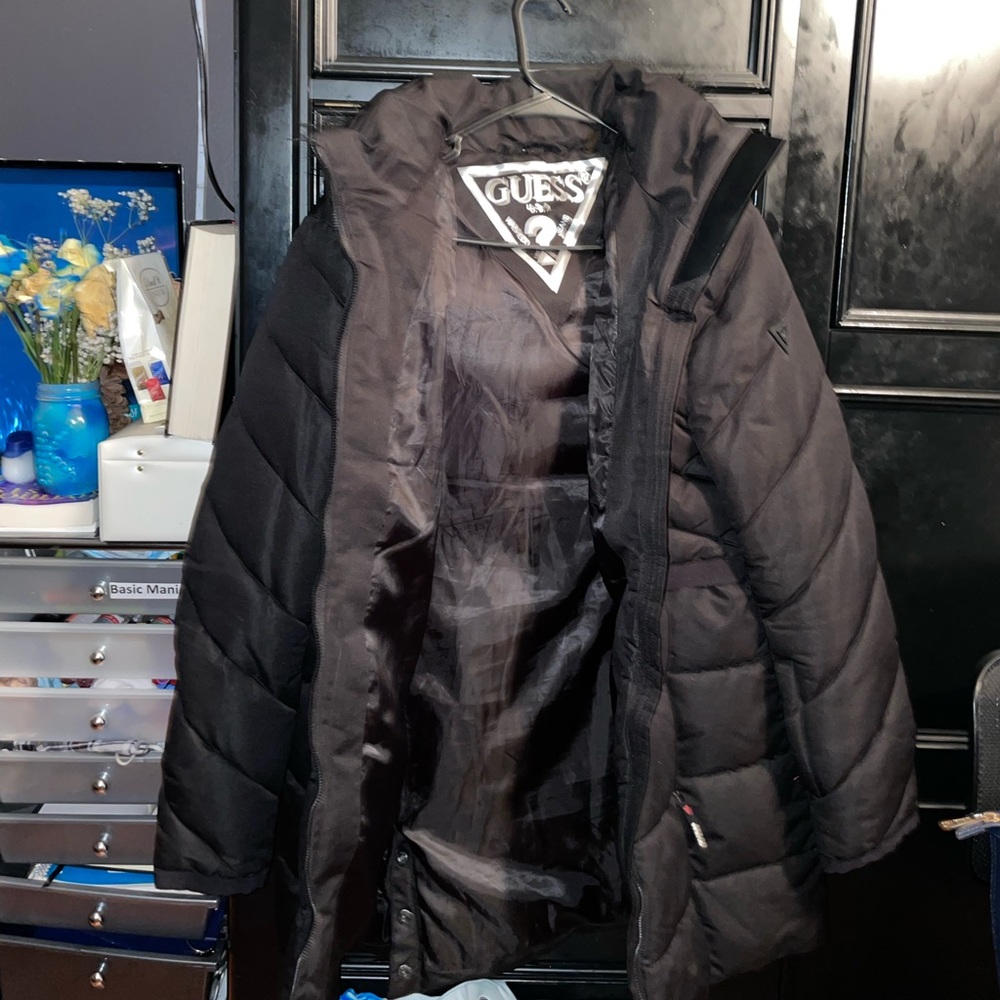 A black Guess coat.